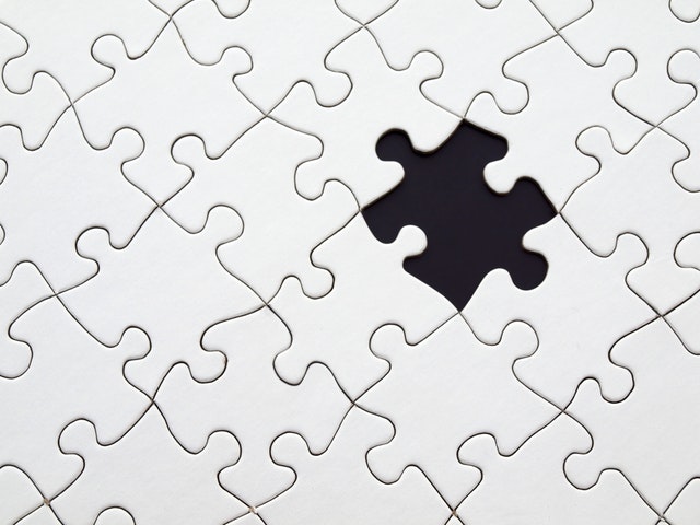 Puzzle with a missing piece.
