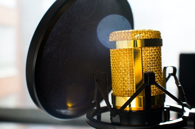 Close Up Photo of Gold-colored and Black Condenser Microphone