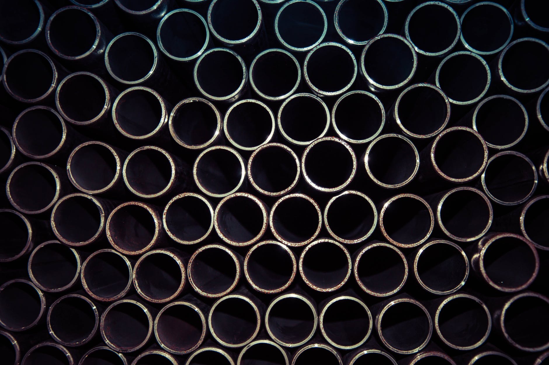 close up photo of gray metal pipes